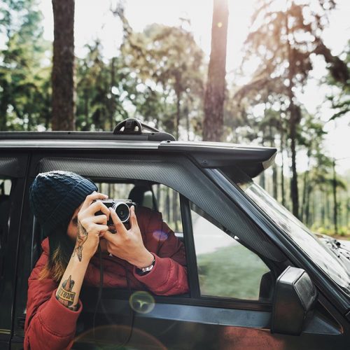 Guy Taking Photos Road Trip Concept